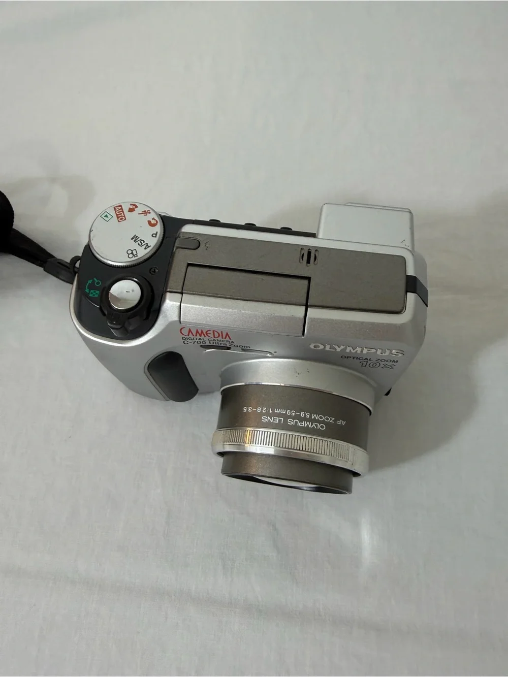 Olympus Silver Compact Digital Camera with Black Wrist Strap